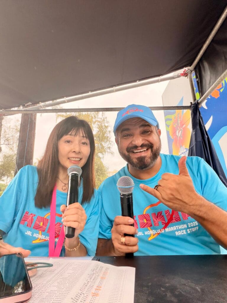 Maleko McDonnell announcing at the Honolulu Marathon finish line